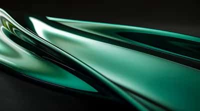Sleek teal chrome blade-like forms with smooth gradients on a dark surface