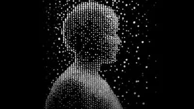 Human head profile formed from scattered white dots and particles on pure black