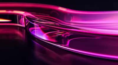Glossy hot-pink and magenta liquid chrome waves flowing across a dark background