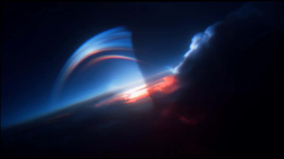 Abstract spiral light beam with blue and orange glow against dark background