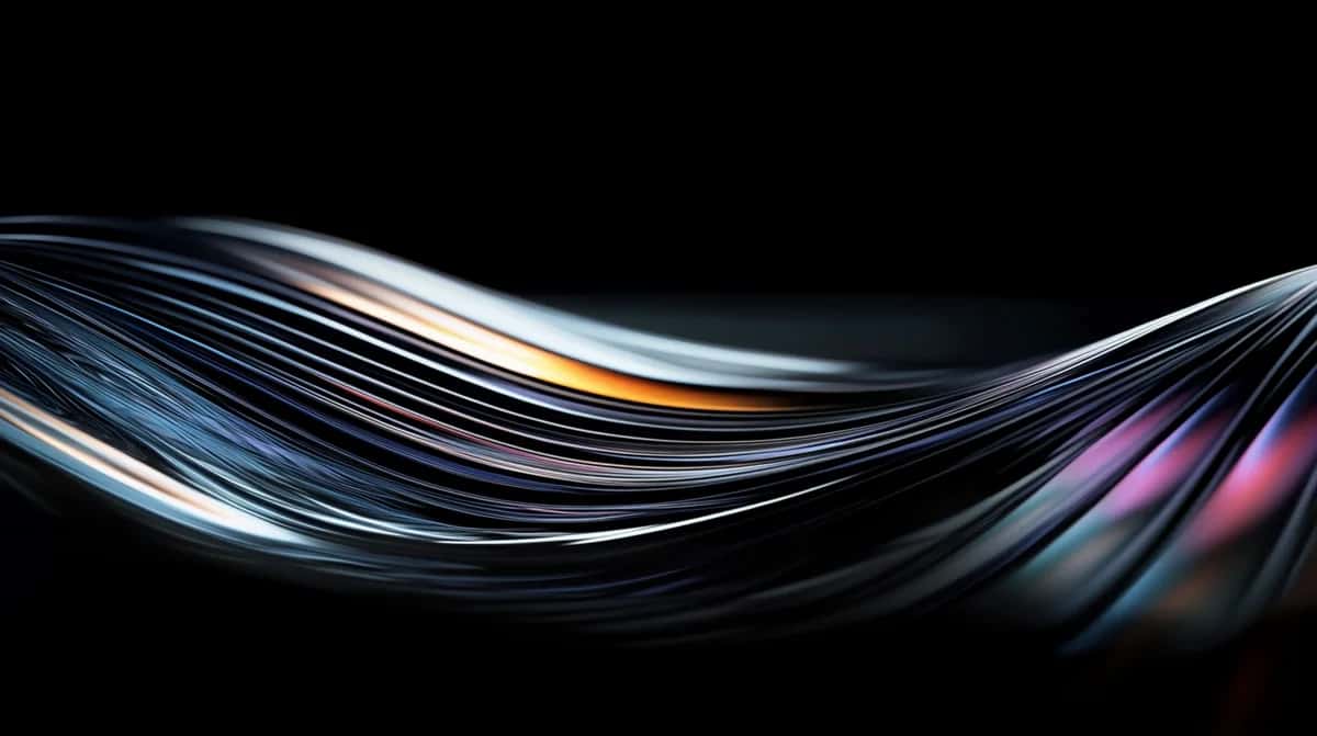 Abstract flowing curves with blue, pink, and gold light streaks on black background
